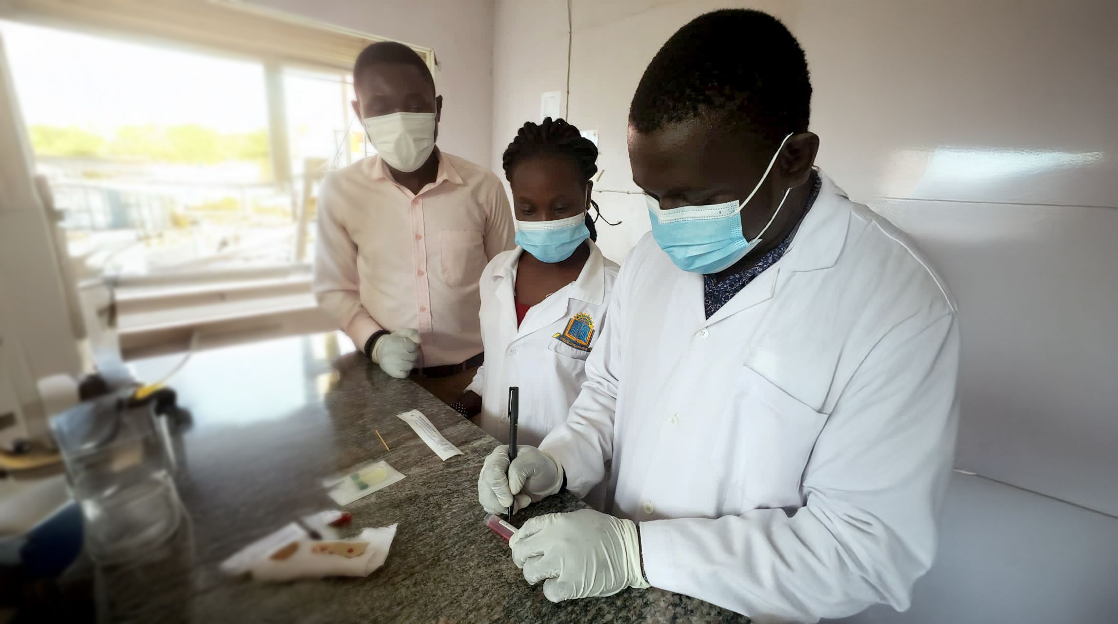 Researchers wearing surgical masks
