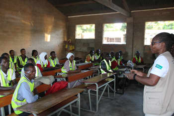 Trainer addresses group of health workers