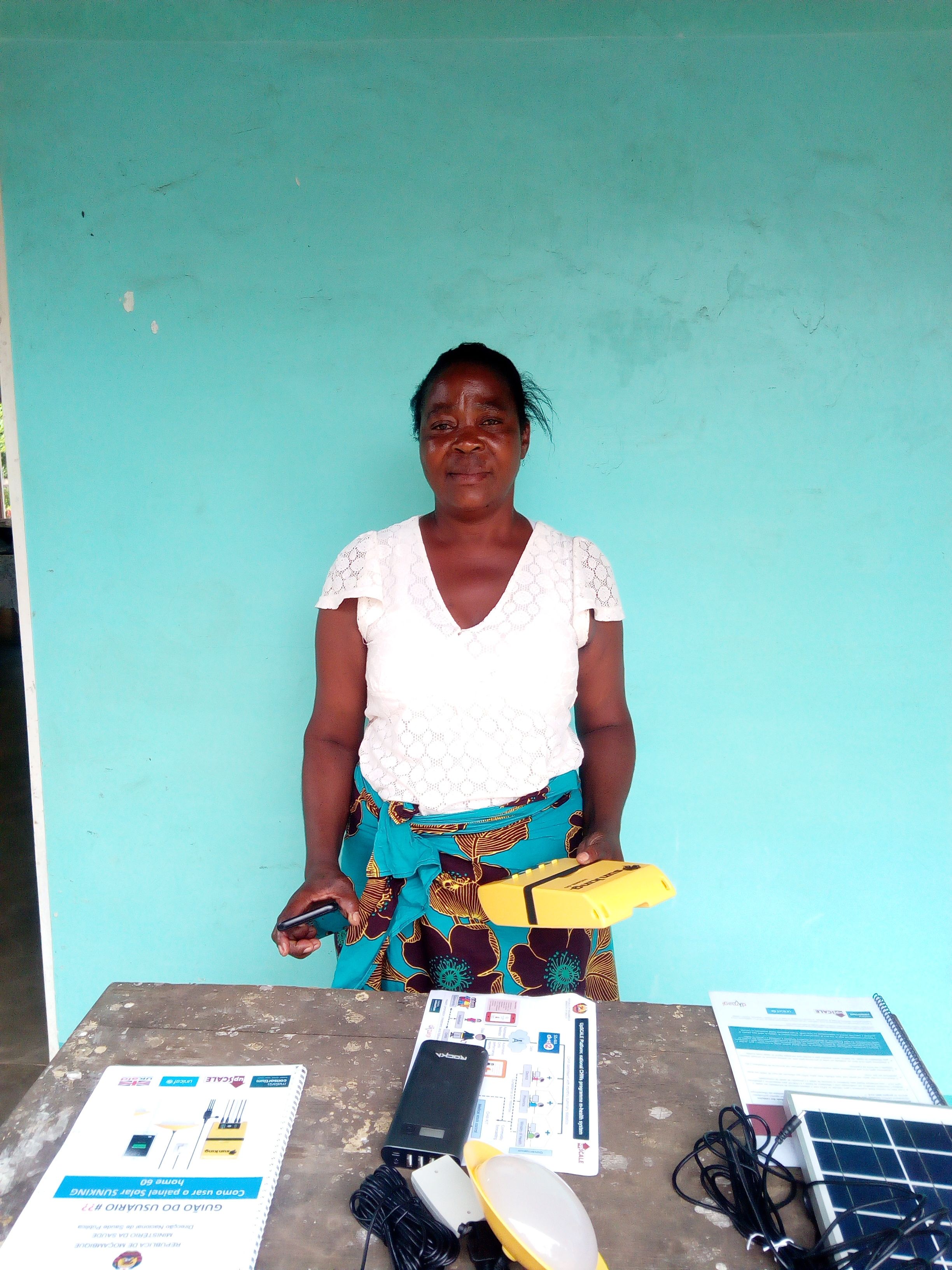 APE standing behind table containing upSCALE equipment and documents